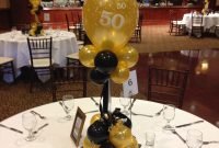 black and gold balloon centerpieces for a 50th birthday or