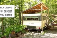 family living off grid in camper trailer &amp; tree house style studio