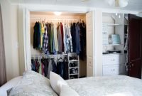 the best white closet bedroom with doors near bed and pillows