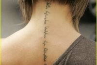 word tattoos for center of back | posh's neck tattoo | posh back